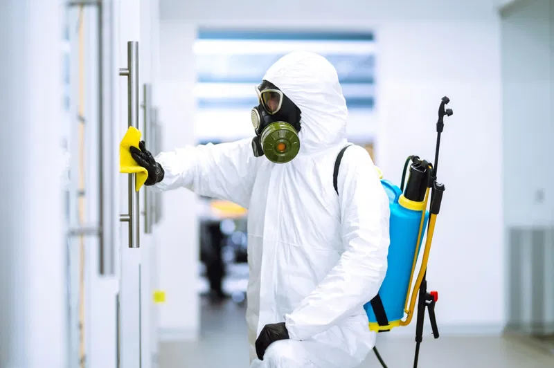Specialist operative carrying out decontamination cleaning